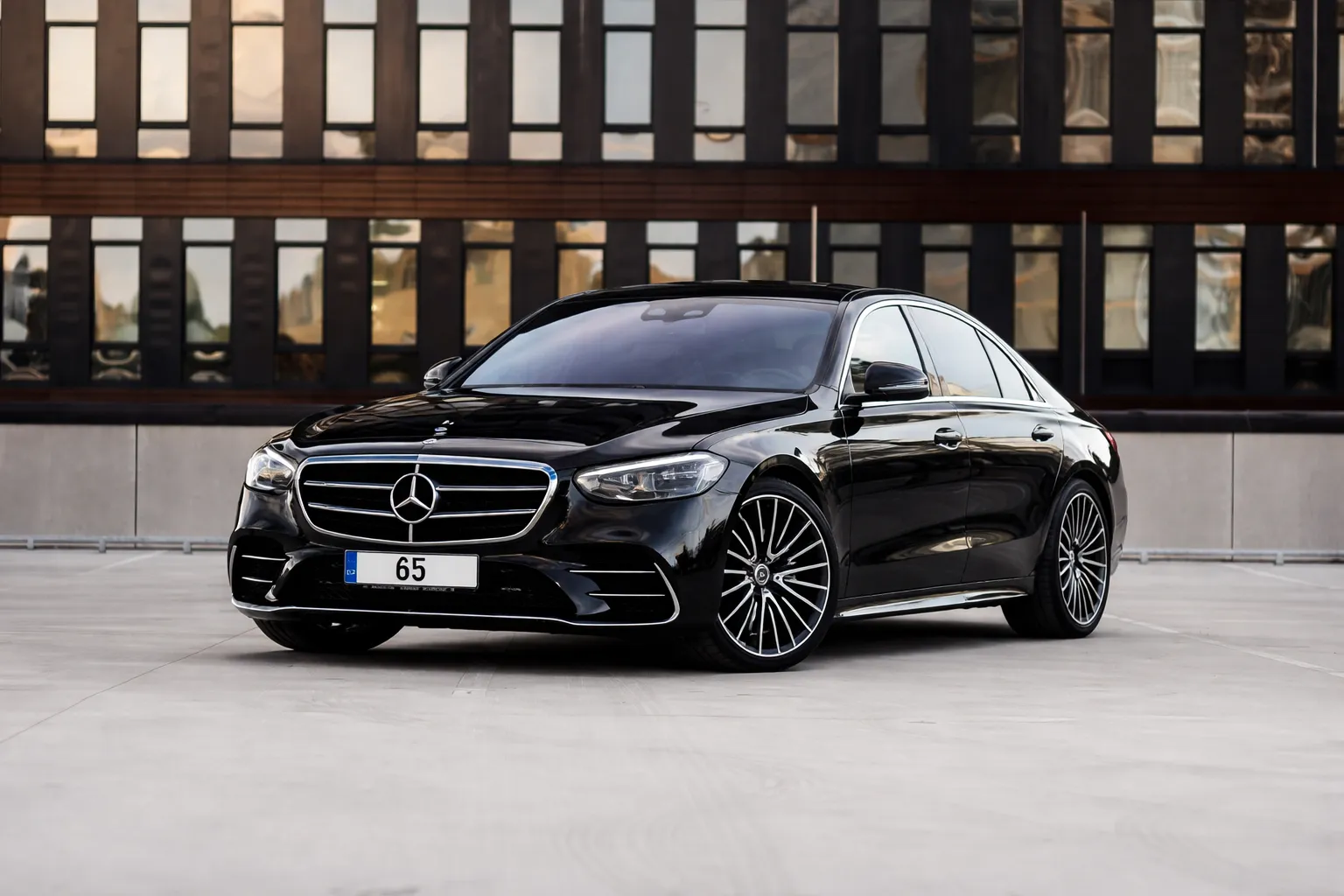 Black Mercedes-Benz S-Class sedan parked in an urban setting, appearing polished and road-ready after a professional Mercedes Benz S Class service.