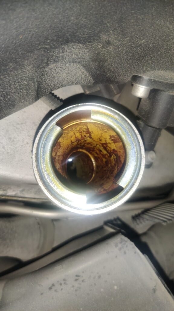 Heavy oil contamination and sludge buildup discovered during inspection.