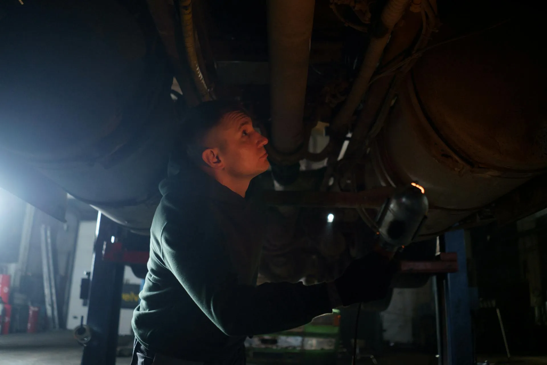 professional car mechanic repairing a car at at vehicle repair shop in Dubai